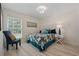 Comfortable bedroom with a queen size bed, chair, and window at 4100 Hagwood Circle, Conway, SC 29526