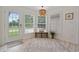 Sunlit breakfast nook features a window-filled view and a cozy bench at 4100 Hagwood Circle, Conway, SC 29526