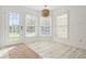 Bright breakfast nook with large windows, stylish light fixture, and access to the outdoors at 4100 Hagwood Circle, Conway, SC 29526