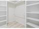 Bright, white walk-in closet with shelves and racks for storage at 4100 Hagwood Circle, Conway, SC 29526