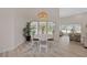 Open dining area boasts a white table, natural light, and seamless connection to the living space at 4100 Hagwood Circle, Conway, SC 29526