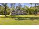 Charming brick home with lush lawn, mature trees, and manicured shrubbery at 4100 Hagwood Circle, Conway, SC 29526