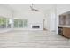 Bright living area with hardwood floors, large windows, and modern fireplace at 4100 Hagwood Circle, Conway, SC 29526