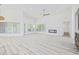 Bright living area with hardwood floors, large windows, and modern fireplace at 4100 Hagwood Circle, Conway, SC 29526