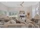 Spacious living area featuring stylish furniture, a fireplace, and ample natural light for a cozy atmosphere at 4100 Hagwood Circle, Conway, SC 29526
