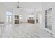 Spacious open-concept living area with hardwood floors and abundant natural light at 4100 Hagwood Circle, Conway, SC 29526