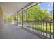 Inviting covered front porch offering a serene view of lush greenery and surrounding trees at 4100 Hagwood Circle, Conway, SC 29526