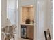 Convenient wet bar featuring unique tile work, a built-in fridge, and cabinet space in an open living area at 4100 Hagwood Circle, Conway, SC 29526