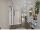 Inviting hallway features wood floors, stylish decor, and seamless flow into the main living areas at 411 Mahogany Dr. # 202, Murrells Inlet, SC 29576