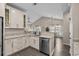 Modern kitchen featuring granite countertops, stainless steel appliances, and ample cabinet space at 411 Mahogany Dr. # 202, Murrells Inlet, SC 29576