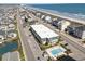 Desirable aerial view showcases beach homes near the ocean, featuring a sparkling community pool at 4201 N Ocean Blvd. # 2H, North Myrtle Beach, SC 29582
