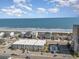 Aerial view of oceanfront homes with pools, offering stunning beach and ocean views at 4201 N Ocean Blvd. # 2H, North Myrtle Beach, SC 29582