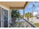 Cozy balcony offers a relaxing outdoor space with nice views of the street and surrounding palm trees at 4201 N Ocean Blvd. # 2H, North Myrtle Beach, SC 29582