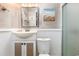 Compact bathroom featuring a vanity sink, decorative mirror, and a convenient shower at 4201 N Ocean Blvd. # 2H, North Myrtle Beach, SC 29582
