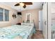 Cozy bedroom featuring a decorative ceiling fan, dresser, and coastal-themed decor at 4201 N Ocean Blvd. # 2H, North Myrtle Beach, SC 29582