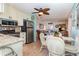 Bright kitchen flowing into the living area, featuring stainless steel appliances and a cozy dining setup at 4201 N Ocean Blvd. # 2H, North Myrtle Beach, SC 29582
