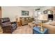 Inviting living room with comfortable seating, stylish decor, and access to a balcony overlooking the water at 4201 N Ocean Blvd. # 2H, North Myrtle Beach, SC 29582