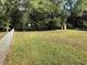 This expansive backyard features mature trees, green grass, and a small storage shed at 4204 Peachtree Ln., Myrtle Beach, SC 29588