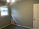 This bedroom features neutral walls and carpet with a door to the hall and window to the exterior at 4204 Peachtree Ln., Myrtle Beach, SC 29588