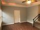 Brightly lit room with wood floors and staircase leading to another level at 4204 Peachtree Ln., Myrtle Beach, SC 29588