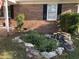 This home features a tranquil water feature and an inviting front porch with chairs at 4204 Peachtree Ln., Myrtle Beach, SC 29588