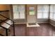 Sunroom has lots of windows, tile entryway, and wood floors with stair access at 4204 Peachtree Ln., Myrtle Beach, SC 29588