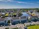 Aerial view of a luxurious waterfront community featuring condominiums, boat docks, and ample parking on a sunny day at 4518 N Planatation Harbour Dr. # G-17, Little River, SC 29566