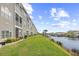 The condo backyard is full of lush green grass and faces a waterway at 4518 N Planatation Harbour Dr. # G-17, Little River, SC 29566