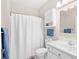 Bright bathroom features a shower with curtain, vanity, and coordinating fixtures at 4518 N Planatation Harbour Dr. # G-17, Little River, SC 29566