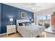 Comfortable primary bedroom features a dark accent wall and access to the balcony at 4518 N Planatation Harbour Dr. # G-17, Little River, SC 29566