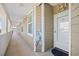Charming walkway leading to a unit with nautical decor, including a helm and pelican art at 4518 N Planatation Harbour Dr. # G-17, Little River, SC 29566