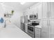 Bright kitchen features stainless steel appliances, stylish cabinets, and modern backsplash at 4518 N Planatation Harbour Dr. # G-17, Little River, SC 29566