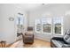 This seating area is filled with natural light, offering views to the neighborhood, and a relaxing atmosphere at 4518 N Planatation Harbour Dr. # G-17, Little River, SC 29566