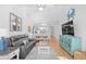 The living room has an open-concept layout and beachy decor, creating a relaxing and inviting space at 4518 N Planatation Harbour Dr. # G-17, Little River, SC 29566