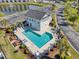 Inviting aerial view of a community pool and hot tub with lounge chairs, surrounded by manicured landscaping at 4518 N Planatation Harbour Dr. # G-17, Little River, SC 29566