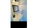 Bright half bath with vanity, framed mirror, white towel, and modern lighting at 4669 Wild Iris Dr. # 22-2O2, Myrtle Beach, SC 29577