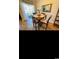 Cozy dining area with wooden table, chairs, and view of outdoor scenery at 4669 Wild Iris Dr. # 22-2O2, Myrtle Beach, SC 29577