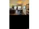 Dining room area showing seating for four, wood floors and a welcome sign at 4669 Wild Iris Dr. # 22-2O2, Myrtle Beach, SC 29577