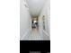 Hallway with tiled floors leading to the kitchen with an open floor plan concept at 4669 Wild Iris Dr. # 22-2O2, Myrtle Beach, SC 29577