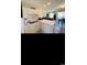 Bright kitchen with white cabinetry, modern appliances, and open to the dining area at 4669 Wild Iris Dr. # 22-2O2, Myrtle Beach, SC 29577