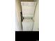 Efficient laundry area featuring a stacked washer and dryer unit with easy access, great for convenience at 4669 Wild Iris Dr. # 22-2O2, Myrtle Beach, SC 29577