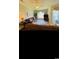 Comfortable living room with brown couches, a ceiling fan, wood style flooring, a sliding glass door and neutral colored walls at 4669 Wild Iris Dr. # 22-2O2, Myrtle Beach, SC 29577