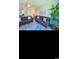 Comfortable living room featuring dual couches, ceiling fan, and natural lighting at 4669 Wild Iris Dr. # 22-2O2, Myrtle Beach, SC 29577