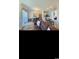 Inviting living room with a dining area and bright kitchen in the background at 4669 Wild Iris Dr. # 22-2O2, Myrtle Beach, SC 29577