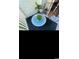 Cozy patio area with blue mosaic table, chairs and plant near sliding glass doors at 4669 Wild Iris Dr. # 22-2O2, Myrtle Beach, SC 29577