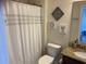 Bathroom featuring modern fixtures, decorative accents, a granite countertop, and a shower with a white curtain at 505 Heartland Ct., Murrells Inlet, SC 29576