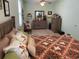 Cozy bedroom with a ceiling fan, comfortable bed, wood furniture, and decorative touches at 505 Heartland Ct., Murrells Inlet, SC 29576