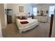 Bright bedroom with a walk-in closet, white furniture, and a view into an en suite bathroom at 505 Heartland Ct., Murrells Inlet, SC 29576
