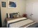 Cozy bedroom with a blue-toned color scheme and comfortable bedding at 505 Heartland Ct., Murrells Inlet, SC 29576