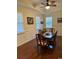 Formal dining area featuring elegant wall trim, hardwood floors, and a chandelier with natural light at 505 Heartland Ct., Murrells Inlet, SC 29576